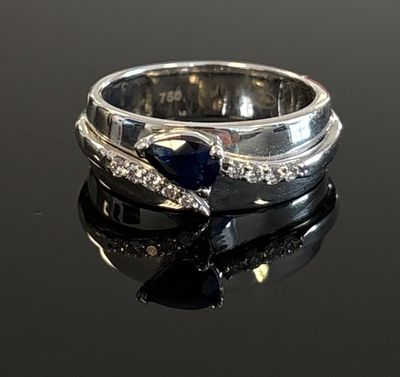 a close up of a ring on a table with a black background