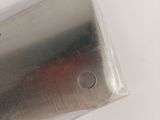 a metal object that is sitting on a white surface