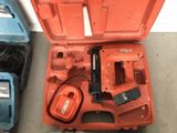 a tool in the case that is sitting on the floor