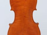an old violin with a wooden back and bow on a white background