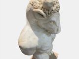 marble bust of a man with a head of flowers on his head