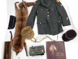 a military uniform and other items laid out on a table