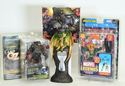 three action figures on the table next to each other