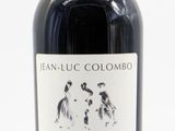 a picture of a bottle of wine with a dog on it