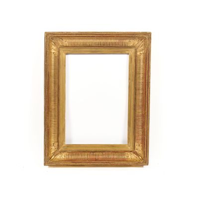 a gold frame with a white background and a white wall