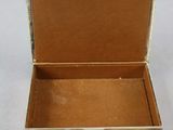 a small box that is open on a white surface