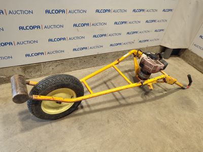 an image of a small yellow car with a big wheel