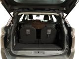 two seats in the back of a car with the trunk open