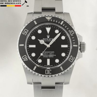 a rolex watch with a black dial on a bracelet