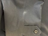 a close up of a person wearing a suit and tie