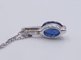 sterling silver necklace with a blue stone on a chain