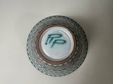 a small glass plate with the word fp on it