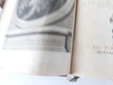 an open book with a drawing of a man ' s face on it