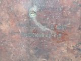 a close up of a piece of metal with writing on it