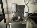 a sink in a small kitchen with a lot of counter space