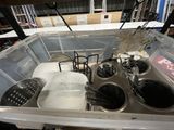 a picture of a kitchen sink with dishes and utensils in it