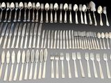 an assortment of silverware including forks, knives and spoons