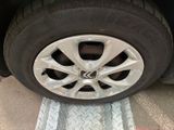 the tire of a car with a flat tire on the ground