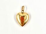 an image of a gold heart charm on a white background
