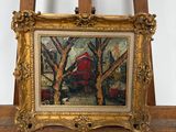 tableau posé sur un chevalet, avec une grange rouge en arrière-plan