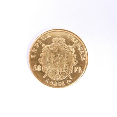 une pièce d'or ornée d'un blason