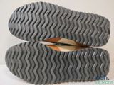 the soles of a pair of shoes are shown on a white surface