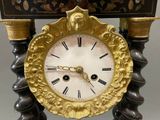a clock that is sitting on top of a table