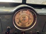 a close up of a car dashboard with a clock on it