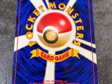 a card game with a red ball on top of it