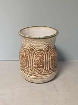 a small vase that is sitting on a table