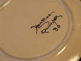 a close up of a plate with writing on it