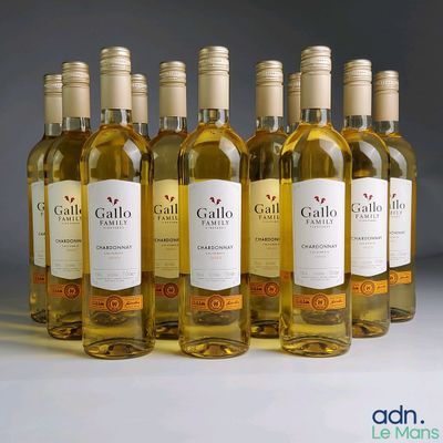 six bottles of white wine are lined up in a row