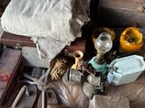 a pile of tools sitting on top of a wooden table