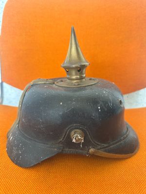 a black helmet sitting on an orange chair