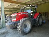 a tractor that is parked in a garage