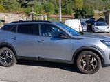 a silver suv that is parked in a parking lot