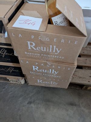 boxes of wine are stacked on top of each other on a pallet