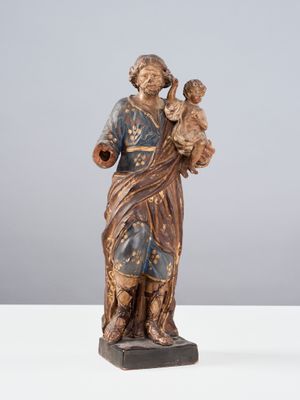 Saint Joseph en terre cuite polychromé et doré. Debout, le s…