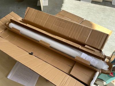 a cardboard box that has a roll of paper on top of it