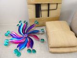 a box with a bunch of items on the floor next to it