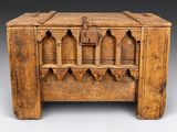 an old wooden chest with a lock on top of it