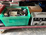 a lot of assorted items sitting on a cart