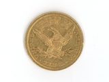 an image of a gold coin on a white surface