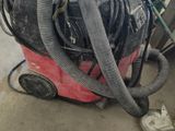 a machine that is sitting on the ground with a hose