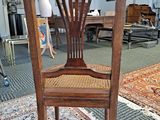 a chair that is sitting on a rug in a room
