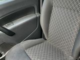 a seat in the back of a car with a steering wheel