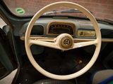 dashboard of a car with a steering wheel and a clock on it