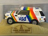 a toy car in a display case on a table