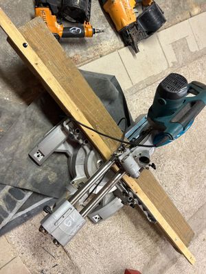 a circular saw on the floor next to a circular saw