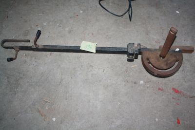 a picture of a metal pipe clamp on the ground